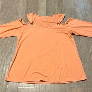 Women’s new peach ish color top. Never worn. Soft material.